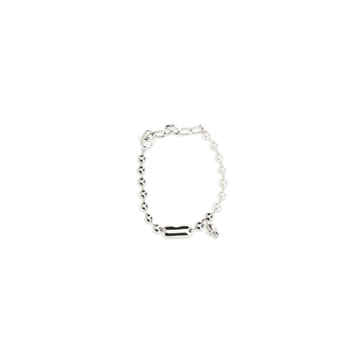 Alexander McQueen armbånd i hvitt messing